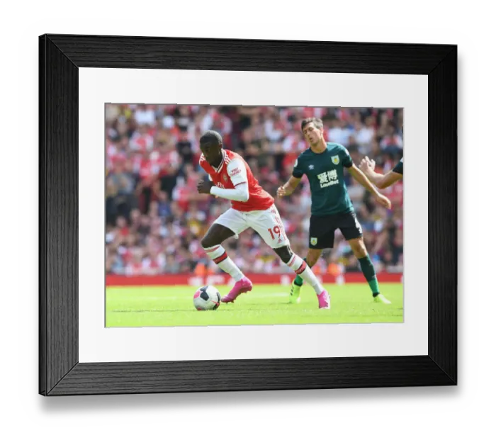 Framed Print : Arsenal's Nicolas Pepe in Action against Burnley in 2019-20 Premier League Framed Print : Arsenal's Nicolas Pepe in Action against Burnley in 2019-20 Premier League