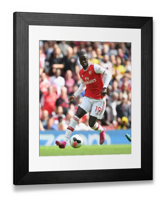 Framed Print : Arsenal's Nicolas Pepe in Action: Premier League Battle against Burnley, 2019-20