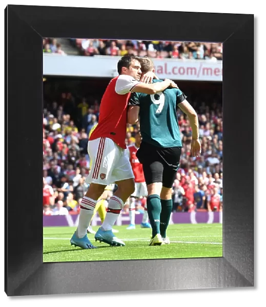 Arsenal's Sokratis Embraces Burnley's Chris Wood in Premier League Clash