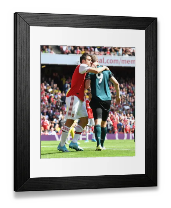 Framed Print : Arsenal's Sokratis Embraces Burnley's Chris Wood in Premier League Clash Framed Print : Arsenal's Sokratis Embraces Burnley's Chris Wood in Premier League Clash