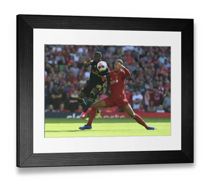 Framed Print : Clash of Titans: Pepe vs. Van Dijk - Premier League Showdown: Arsenal's Pepe Takes on Liverpool's Van Dijk