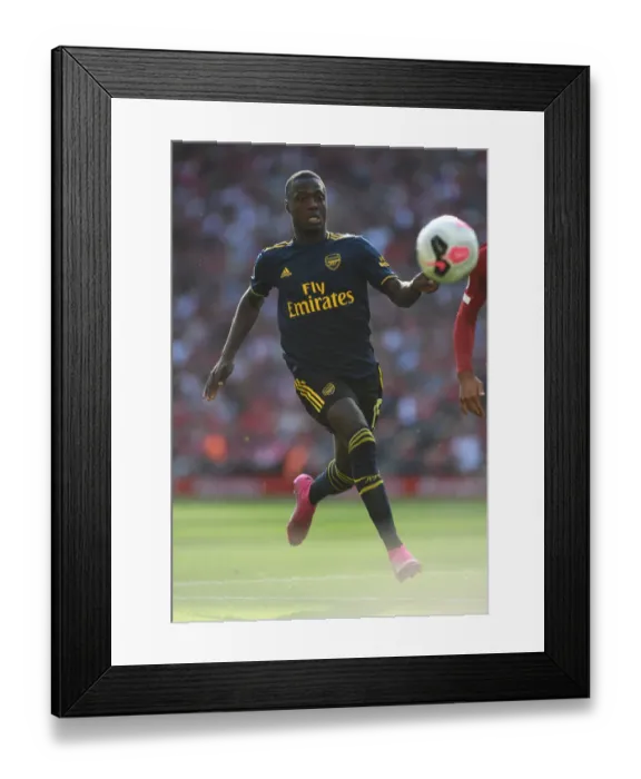 Framed Print : Pepe vs. Liverpool: Arsenal's Star Face-Off in Premier League Clash