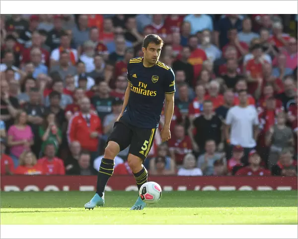 Sokratis of Arsenal Faces Off Against Liverpool FC in Premier League Clash