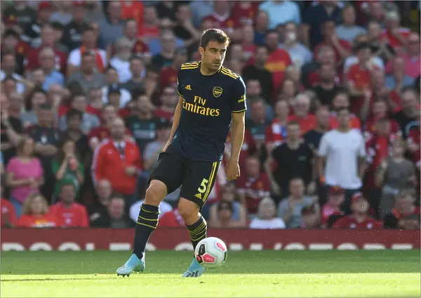 Sokratis of Arsenal Faces Off Against Liverpool FC in Premier League Clash