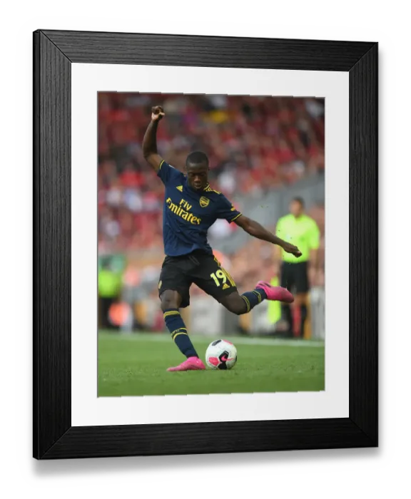 Framed Print : Pepe vs. Liverpool: Arsenal's Star Forward Faces Off in Premier League Showdown