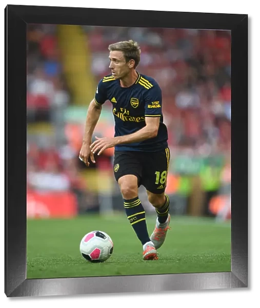 Nacho Monreal in Action: A Riveting Moment from the Liverpool vs. Arsenal Premier League Clash 2019-20
