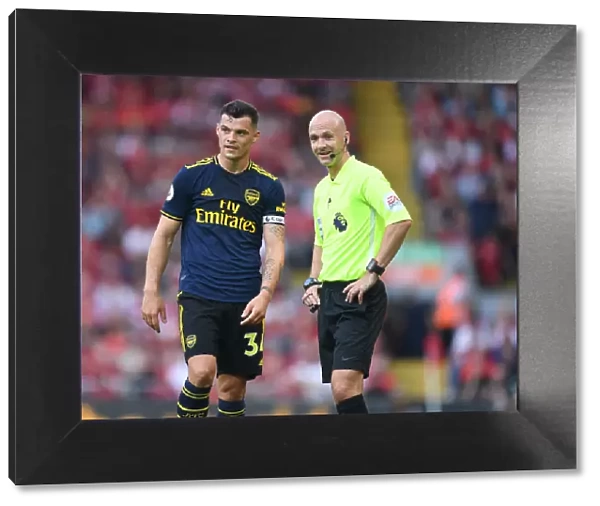 Xhaka and Referee Taylor in Heated Discussion: Liverpool vs. Arsenal, Premier League 2019-20
