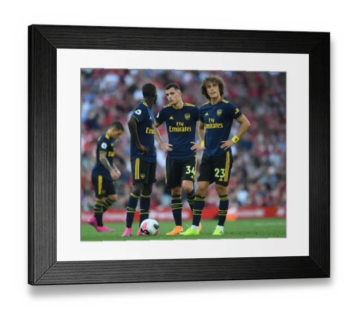 Framed Print : Arsenal's Xhaka, Pepe, and Luiz Face Off Against Liverpool in Premier League Clash