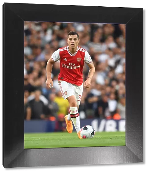Arsenal's Granit Xhaka in Action Against Tottenham in the 2019-20 Premier League