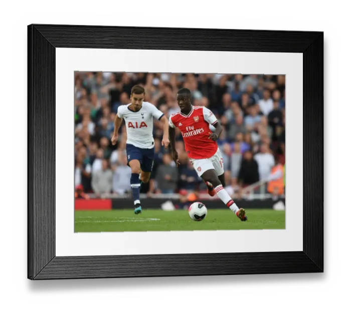Framed Print : Arsenal's Nicolas Pepe Outmaneuvers Tottenham's Harry Winks in the 2019-20 Premier League Clash Framed Print : Arsenal's Nicolas Pepe Outmaneuvers Tottenham's Harry Winks in the 2019-20 Premier League Clash