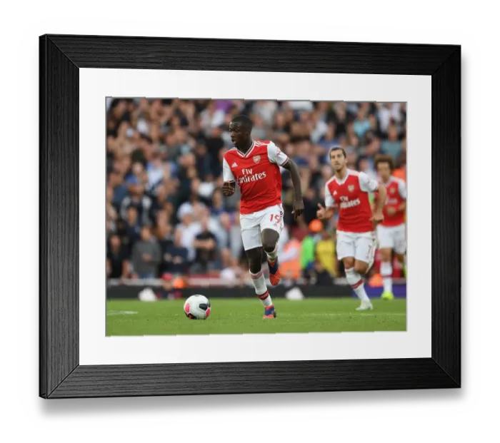 Framed Print : Pepe vs. Tottenham: Intense Head-to-Head Clash in Arsenal's Premier League Battle