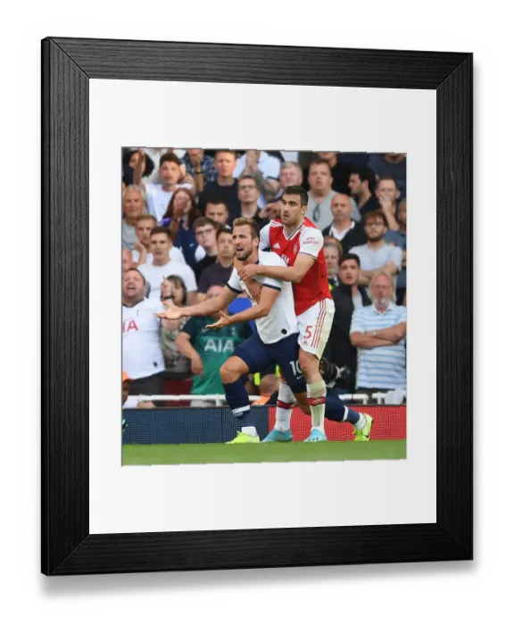 Framed Print : Clash of Titans: Arsenal's Sokratis vs. Tottenham's Harry Kane - Premier League Showdown