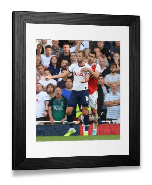 Framed Print : Clash of the Capitals: Sokratis vs. Kane - Arsenal vs. Tottenham, Premier League 2019-20