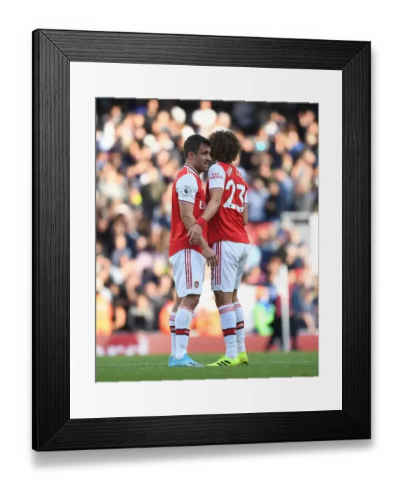 Framed Print : Arsenal's Sokratis and David Luiz: United in Defiance against Tottenham in the Premier League