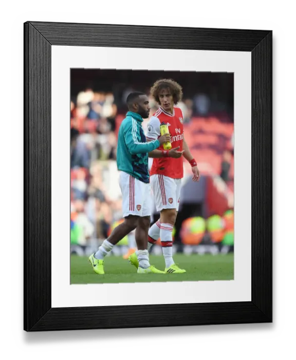 Framed Print : Arsenal's Lacazette and Luiz: Victory Celebration Against Tottenham Framed Print : Arsenal's Lacazette and Luiz: Victory Celebration Against Tottenham