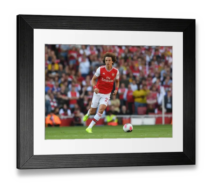 Framed Print : Arsenal's David Luiz Faces Off Against Tottenham in Premier League Clash
