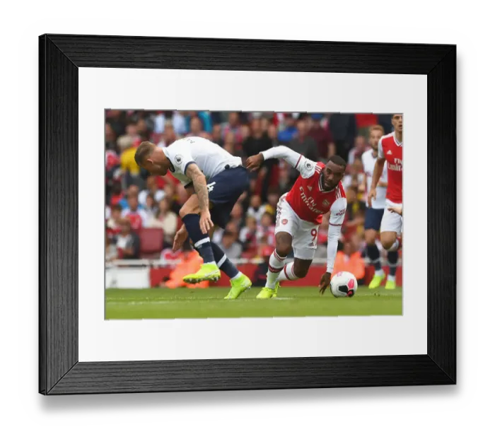 Framed Print : Battle at the Emirates: Lacazette vs. Alderweireld - Arsenal vs. Tottenham Premier League Showdown Framed Print : Battle at the Emirates: Lacazette vs. Alderweireld - Arsenal vs. Tottenham Premier League Showdown