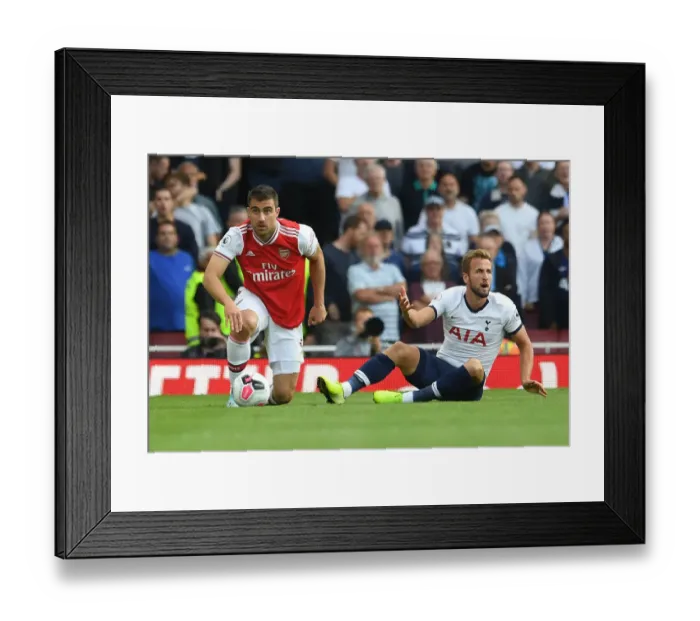 Framed Print : Arsenal vs. Tottenham: Intense Clash between Sokratis and Kane at the Emirates Stadium