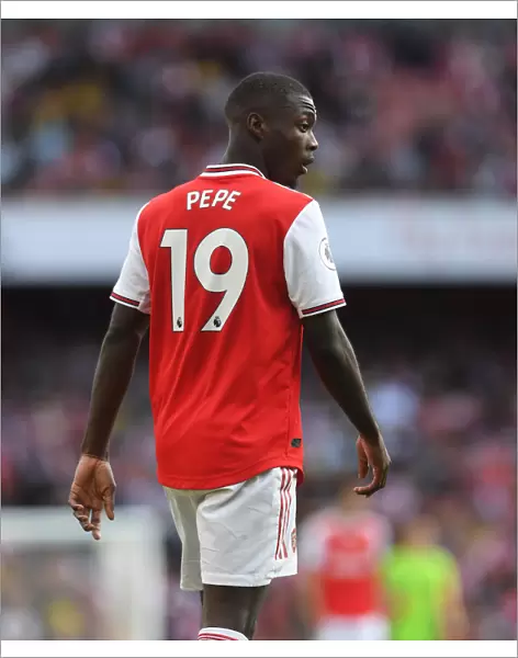 Arsenal's Nicolas Pepe Goes Head-to-Head with Tottenham in Intense 2019-20 Premier League Showdown