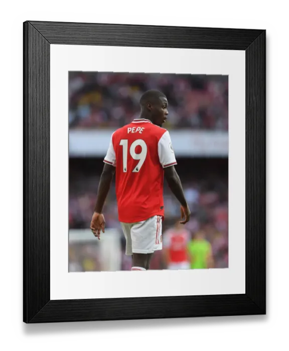 Framed Print : Arsenal's Nicolas Pepe Goes Head-to-Head with Tottenham in Intense 2019-20 Premier League Showdown