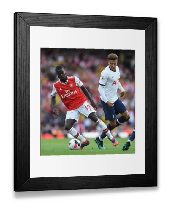 Framed Print : Arsenal vs. Tottenham: Pepe and Alli Clash in the Premier League