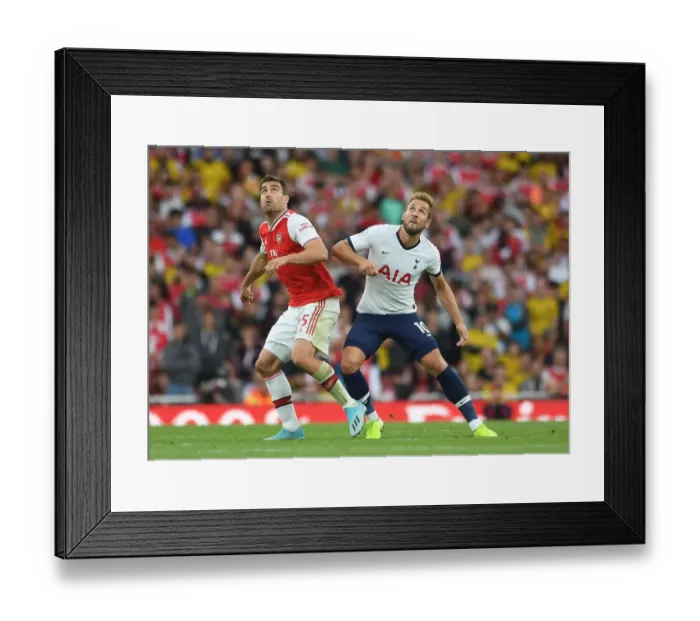 Framed Print : Arsenal vs. Tottenham: Sokratis Challenges Kane in Intense Premier League Clash (2019-20)