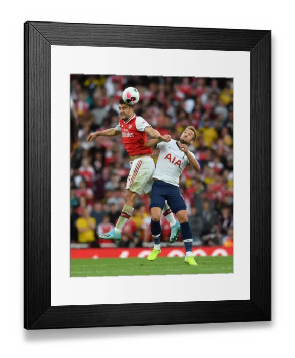 Framed Print : Arsenal vs. Tottenham: Sokratis and Kane Clash in Intense Premier League Showdown