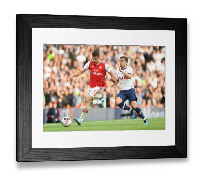 Framed Print : Arsenal vs. Tottenham: Sokratis Clashes with Winks in the Premier League Showdown at Emirates Stadium Framed Print : Arsenal vs. Tottenham: Sokratis Clashes with Winks in the Premier League Showdown at Emirates Stadium