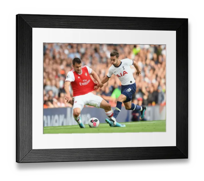 Framed Print : Arsenal vs. Tottenham: Sokratis Clashes with Harry Winks in the 2019-20 Premier League Showdown Framed Print : Arsenal vs. Tottenham: Sokratis Clashes with Harry Winks in the 2019-20 Premier League Showdown