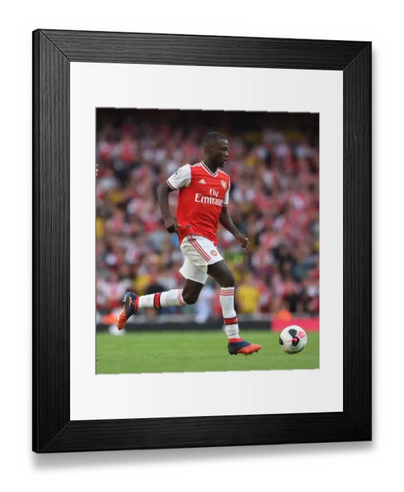 Framed Print : Arsenal's Nicolas Pepe Faces Off Against Tottenham in Premier League Showdown