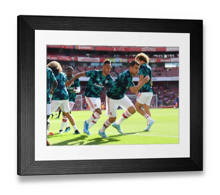 Framed Print : Arsenal vs. Tottenham: Sokratis Warming Up Ahead of Premier League Clash at Emirates Stadium
