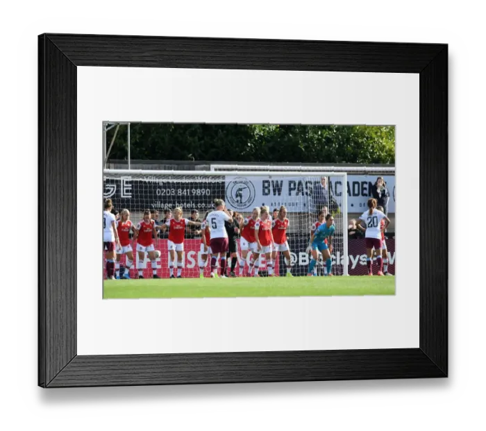 Framed Print : Arsenal Women Guard Indirect Free Kick Against West Ham United in WSL Action Framed Print : Arsenal Women Guard Indirect Free Kick Against West Ham United in WSL Action