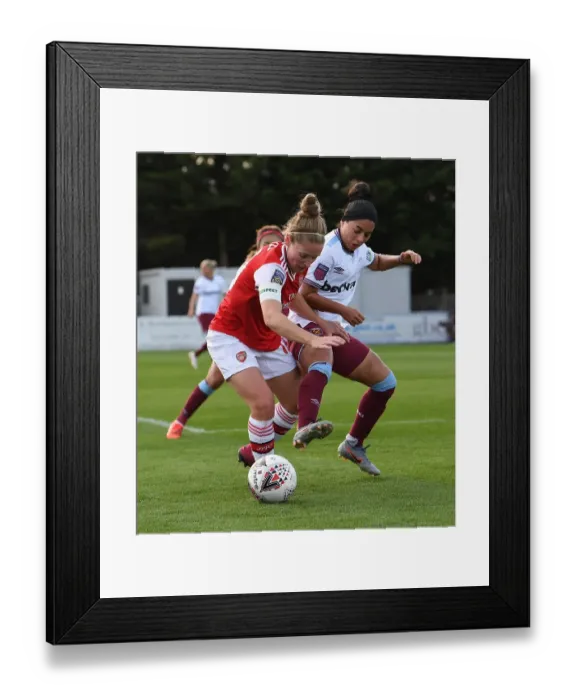 Framed Print : Intense Battle: Arsenal Women vs West Ham United at Meadow Park
