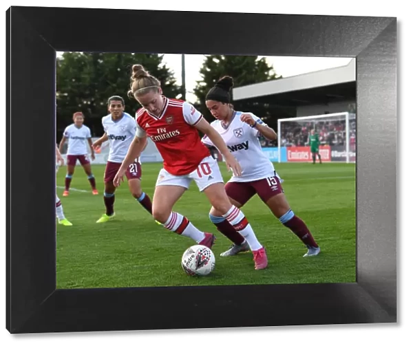 Intense Battle: Arsenal Women vs West Ham United at Meadow Park