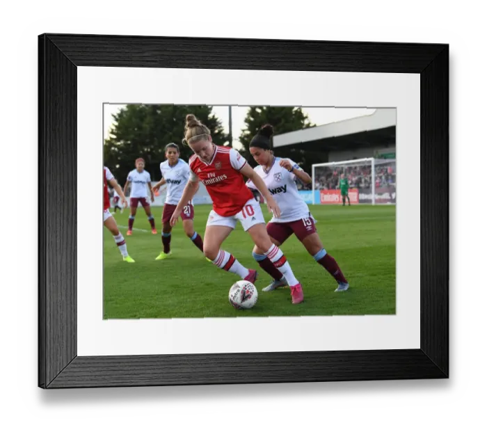 Framed Print : Intense Battle: Arsenal Women vs West Ham United at Meadow Park