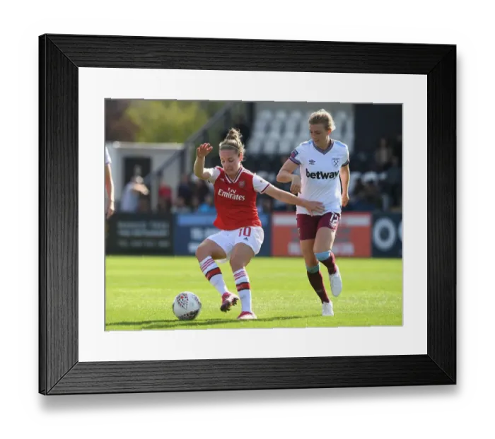Framed Print : Arsenal vs. West Ham: A Fierce Face-Off Between Kim Little and Kate Longhurst in the WSL Clash - Battle of the Midfielders