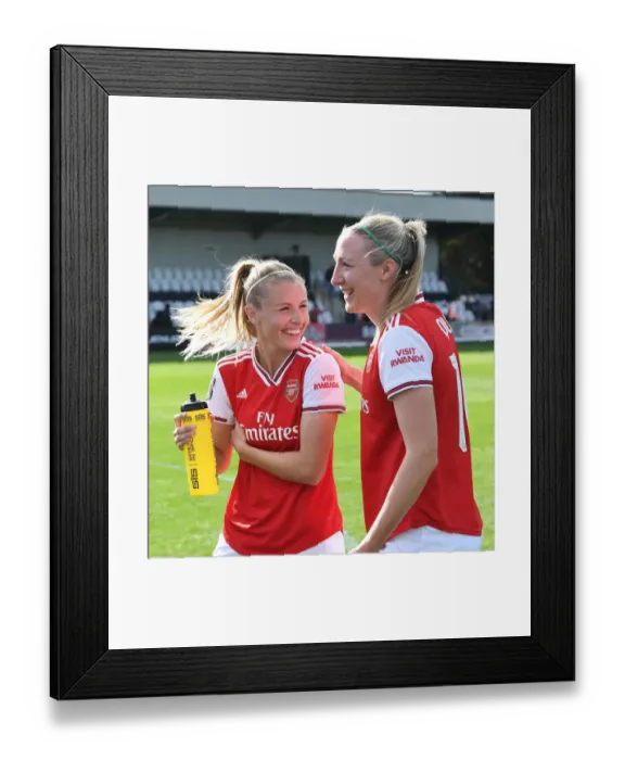 Framed Print : Arsenal Women: Leah Williamson and Louise Quinn Embrace in Heartfelt Post-Match Moment