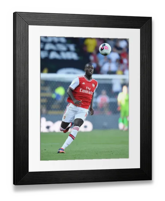 Framed Print : Pepe in Action: Arsenal's Star Winger Shines in Premier League Clash Against Watford