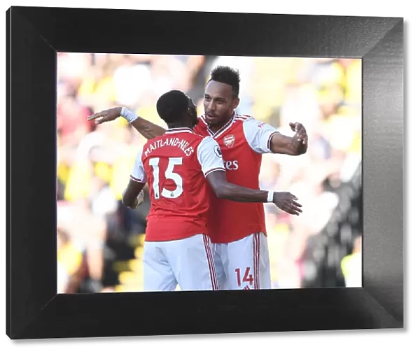 Aubameyang and Maitland-Niles Celebrate Arsenal's Victory over Watford (2019-20)