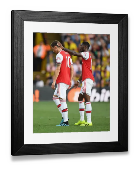 Framed Print : Mesut Ozil Consoled by Ainsley Maitland-Niles After Substitution: Watford vs Arsenal, Premier League 2019-20 Framed Print : Mesut Ozil Consoled by Ainsley Maitland-Niles After Substitution: Watford vs Arsenal, Premier League 2019-20