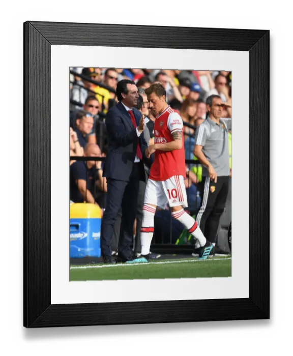 Framed Print : Unai Emery and Mesut Ozil: A Moment After Substitution (2019-20) - Arsenal at Watford