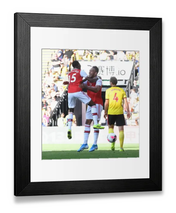 Framed Print : Aubameyang and Maitland-Niles Celebrate Arsenal's Win Against Watford (2019-20) Framed Print : Aubameyang and Maitland-Niles Celebrate Arsenal's Win Against Watford (2019-20)
