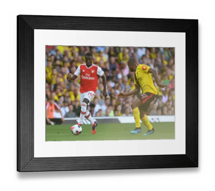 Framed Print : Pepe vs Kabasele: Battle at Vicarage Road - Watford vs Arsenal, Premier League 2019-20 Framed Print : Pepe vs Kabasele: Battle at Vicarage Road - Watford vs Arsenal, Premier League 2019-20