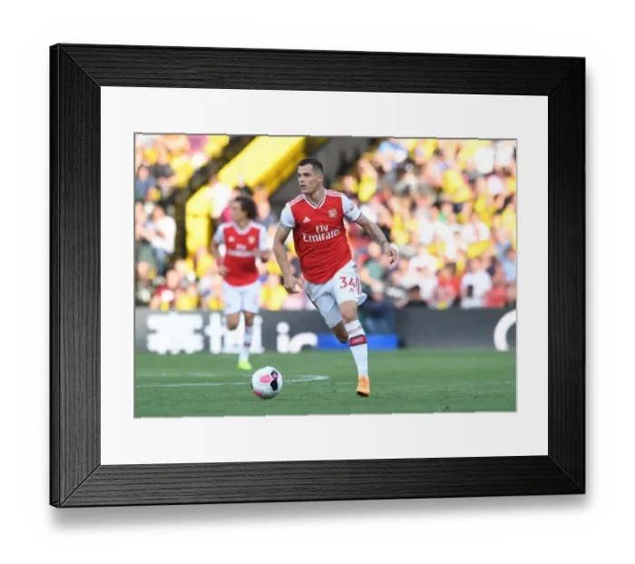 Framed Print : Granit Xhaka's Brilliant Midfield Performance: Arsenal Triumphs Over Watford (2019-20) Framed Print : Granit Xhaka's Brilliant Midfield Performance: Arsenal Triumphs Over Watford (2019-20)