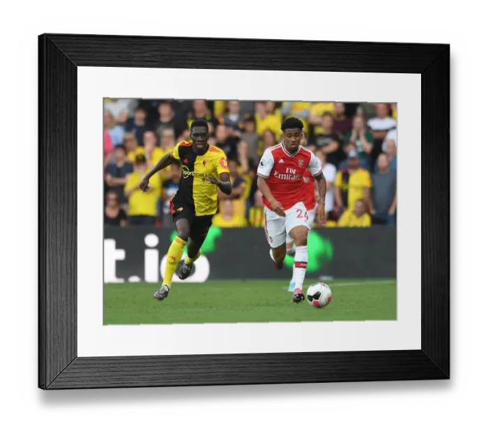 Framed Print : Watford vs Arsenal: Nelson vs Sarr Clash in Premier League Showdown Framed Print : Watford vs Arsenal: Nelson vs Sarr Clash in Premier League Showdown