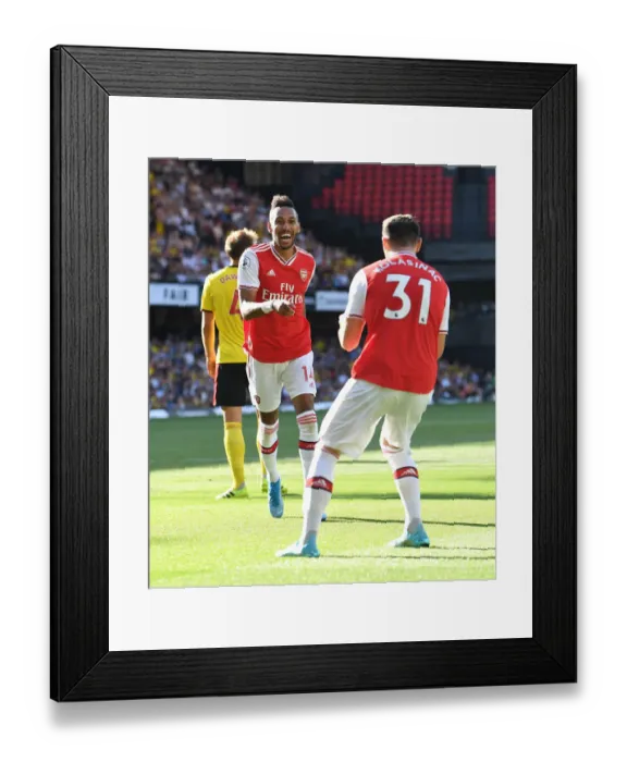 Framed Print : Arsenal's Aubameyang Scores Brace: Arsenal Secures Victory Against Watford in 2019-20 Premier League Framed Print : Arsenal's Aubameyang Scores Brace: Arsenal Secures Victory Against Watford in 2019-20 Premier League