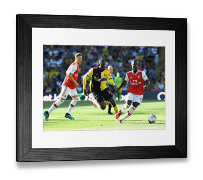 Framed Print : Pepe vs Doucoure: Intense Moment from Watford vs Arsenal Premier League Clash