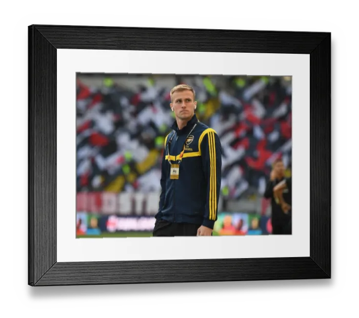 Framed Print : Arsenal's Rob Holding Prepares for Eintracht Frankfurt Clash in Europa League Group Stage
