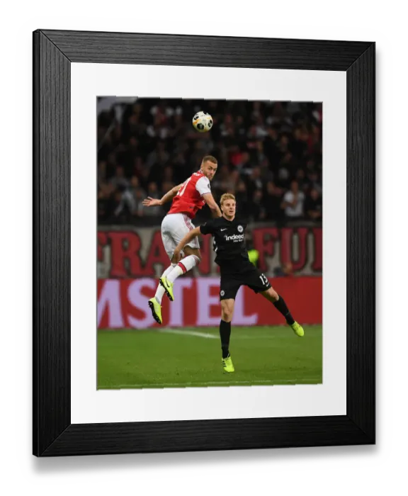 Framed Print : Arsenal's Calum Chambers Faces Off Against Eintracht Frankfurt's Martin Hinteregger in Europa League Clash Framed Print : Arsenal's Calum Chambers Faces Off Against Eintracht Frankfurt's Martin Hinteregger in Europa League Clash