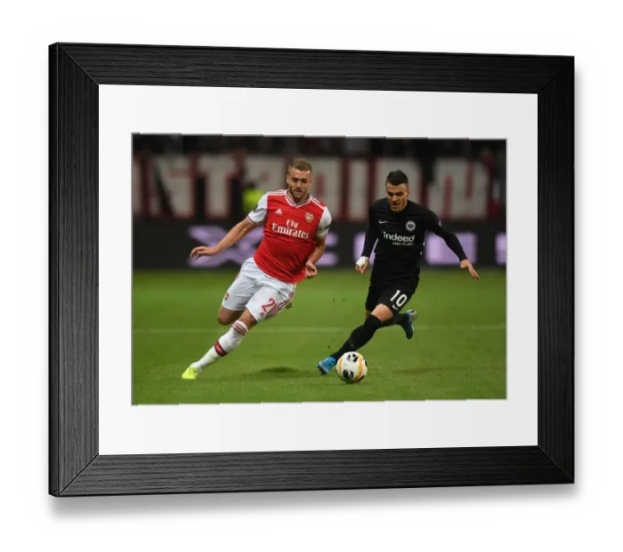 Framed Print : Chambers vs. Kostic: Clash in Europa League Group F between Eintracht Frankfurt and Arsenal FC Framed Print : Chambers vs. Kostic: Clash in Europa League Group F between Eintracht Frankfurt and Arsenal FC